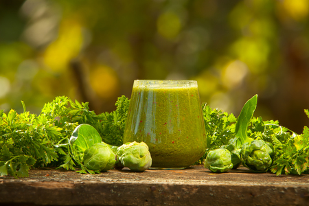 delicious green smoothies from fresh verdure in a glassの写真素材