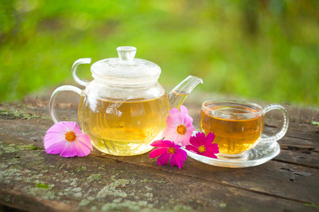 delicious green tea in a beautiful glass bowl on a tableの写真素材