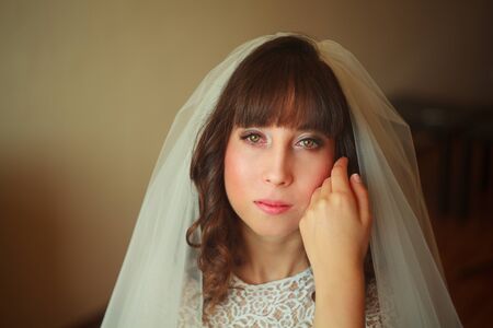 beautiful bride with veil smilingの写真素材