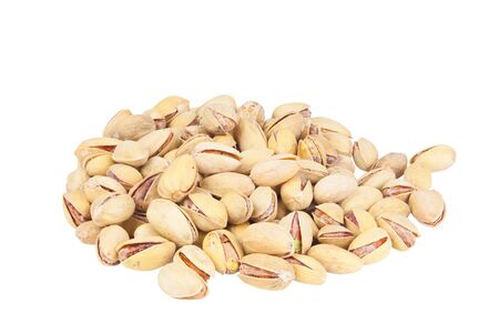 delicious pistachio nuts on a plate on a white backgroundの写真素材