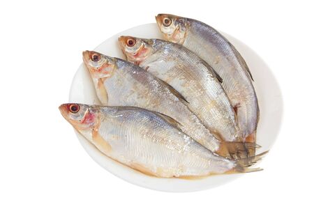 peled raw fish on a white plate on a white background