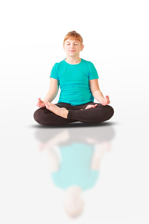beautiful flexible woman doing yoguna white backgroundの写真素材