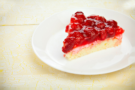delicious cheesecake with strawberries on a plateの写真素材