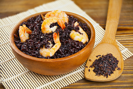 Pilaf with shrimp from wild black rice on the tableの写真素材