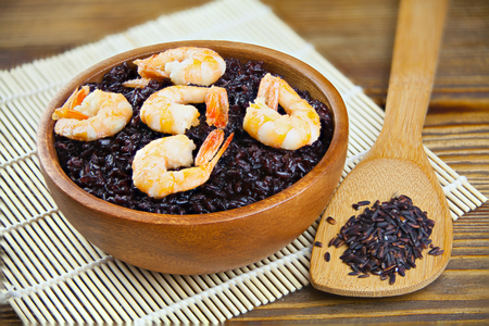 Pilaf with shrimp from wild black rice on the tableの写真素材