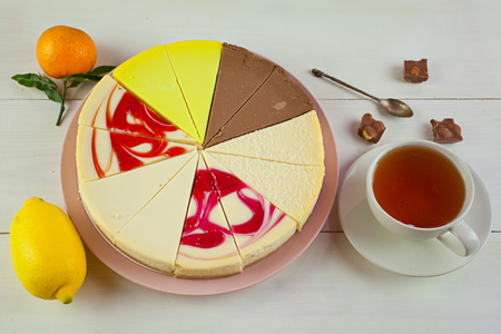 assorted cheesecake on a plate on a white tableの写真素材