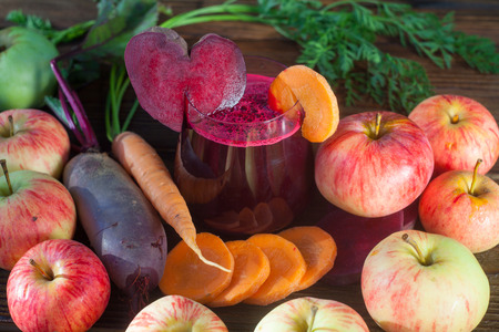beet  juice in glass on wooden tableの写真素材