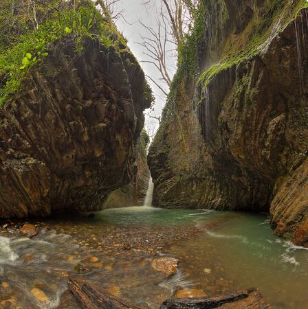 beautiful landscape in the mountains with a waterfall in springの写真素材