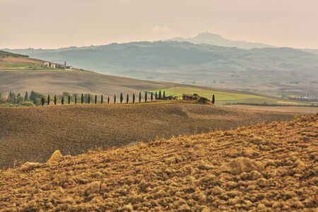 Natural landscape of hills tuscany in autumn in Italyの写真素材