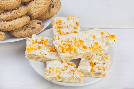 delicious christmas cake on a plate on a wooden background