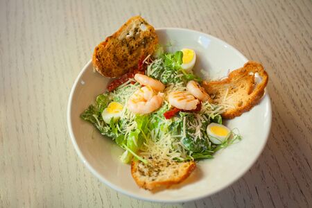 delicious rustic salad on a plate on a white backgroundの写真素材