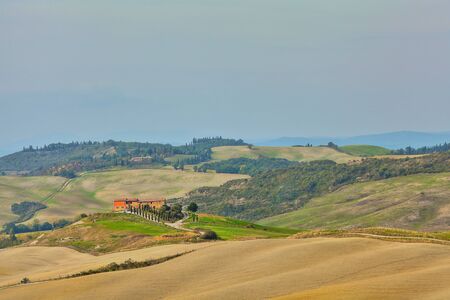 Natural landscape of hills tuscany in autumn in Italyの写真素材
