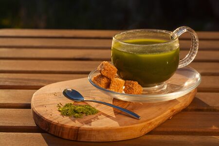 Matcha green tea crystal cups on a table without people
