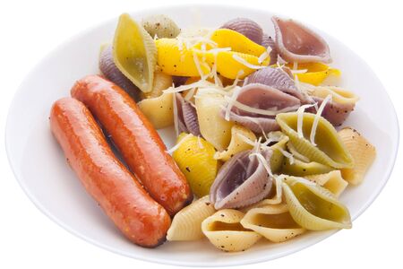tasty appetizing pasta with German sausages on a white plateの写真素材