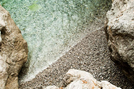 transparent water between rocksの写真素材