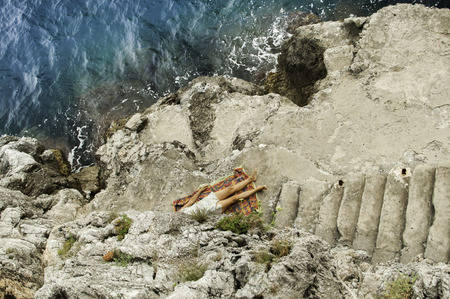 Person resting on the cliff Furoreの写真素材