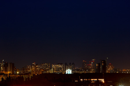 many houses light from the windows of the night cityの写真素材