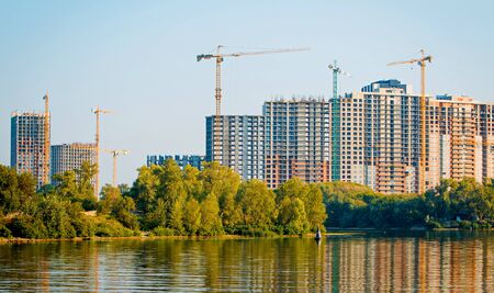 construction of multi-storey houses on the shore of a beautiful lake