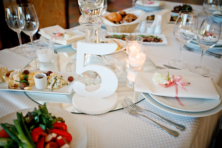 beautiful holiday wedding feast with candles and flowersの写真素材