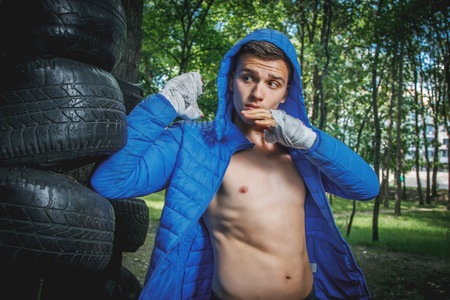strong young boxer trains fists and hands