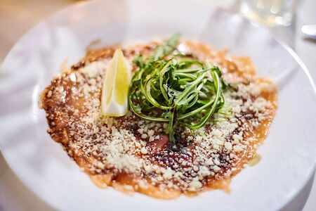 cheese casserole dessert with arugula and lemonの写真素材