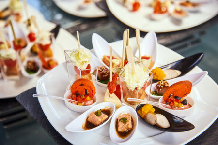 beautifully served gourmet seafood snacks at the feastの写真素材