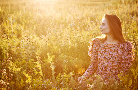 girl in the field in the sunの写真素材