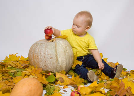 child with pumpkinの写真素材