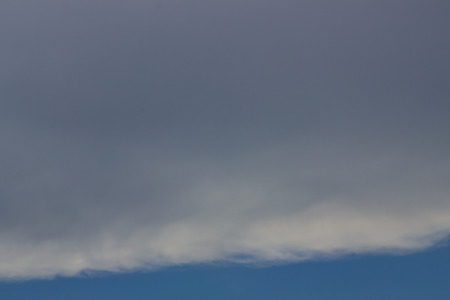 beautiful blue summer sky with white fluffy cloudsの写真素材