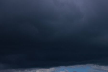 thunderstorm over the sea. dark blue stormy sky
