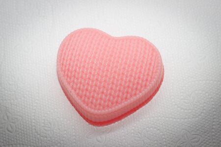 handmade soap on a white background in the shape of a heartの写真素材
