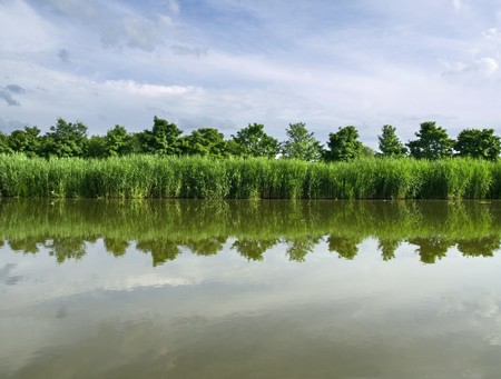 Shore of the canal of Chambord Castleの写真素材