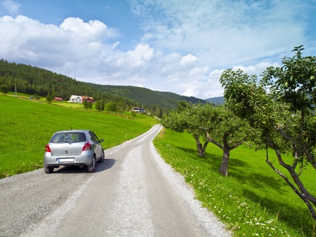 Car parked in the beautiful surroundings of Kaupanger in Norwayの写真素材