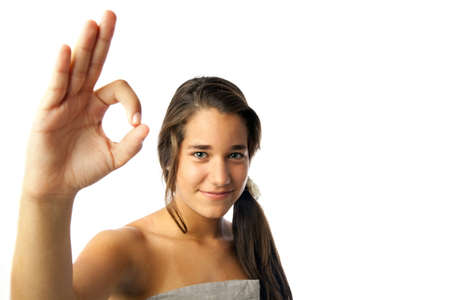 A teenage girl making an OK sign with his handの写真素材