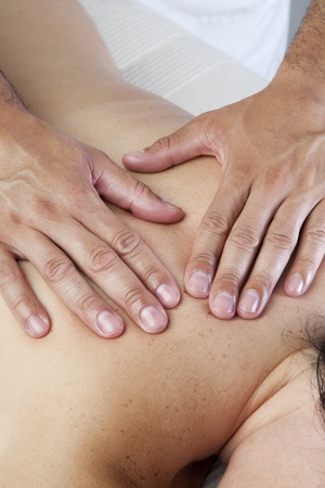 Man hands giving a back massageの写真素材