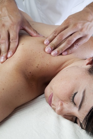 Man hands giving a back massageの写真素材