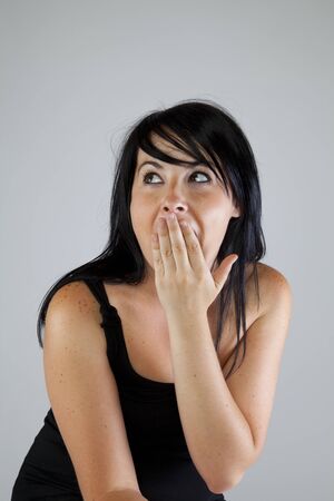 Young girl with a surprise expression の写真素材