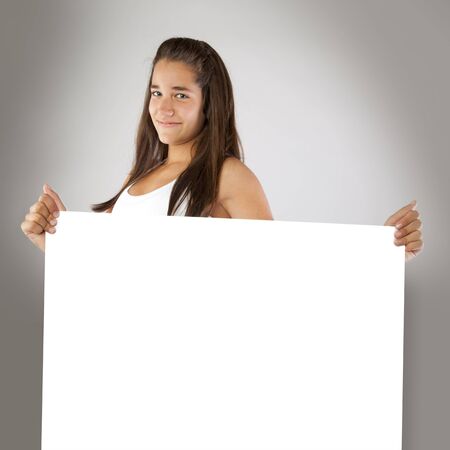 Cheerful Teenager Holding an Empty Boardの写真素材