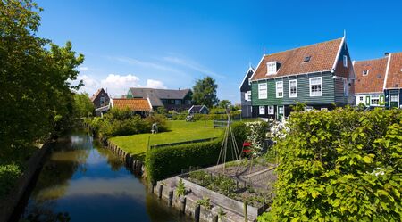 Marken is a peninsula in the IJsselmeer, the Netherlands, located in the municipality Waterland in the province North Holland  It is a former island, which nowadays is connected to the North Holland mainland by a causeway  の写真素材