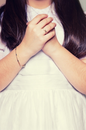 Hands of a Little Girl in her First Communion Dayの写真素材