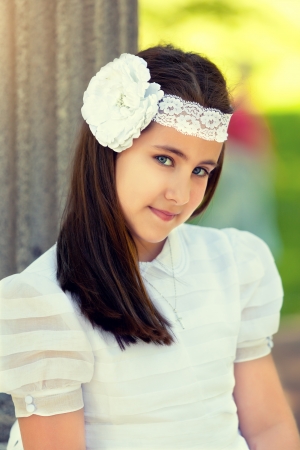 Cute Little Girl with her First Communion Dressの写真素材