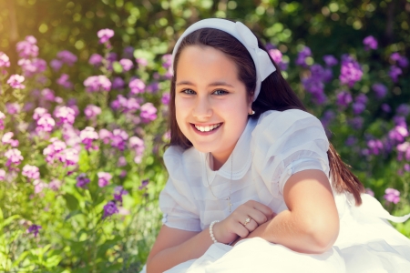 Cute Little Girl with her First Communion Dressの写真素材