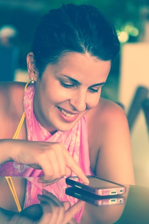 Happy Woman Smiling and Texting on a Mobile
