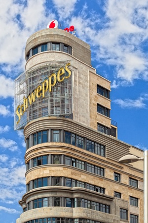 MADRID, SPAIN - AUGUST 12: Capitol Building, designed by architects Luis Martinez-Feduchi and Vicente Eced y Eced and built between 1931 and 1933, is one of the best known of the Gran Via street. Has been considered as an icon of the street in the centenaの写真素材