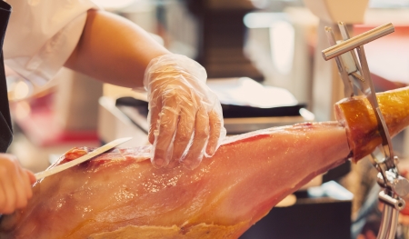 Cutting Serrano Ham in a Traditional Shopの写真素材