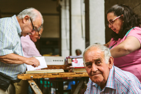 MADRID, SPAIN - SEPTEMBER 7: People at the Collectible Market of Stamps and Coins in Plaza Mayor, one of the most traditional Madrid classics on September 7, 2012 in Madrid.のeditorial素材