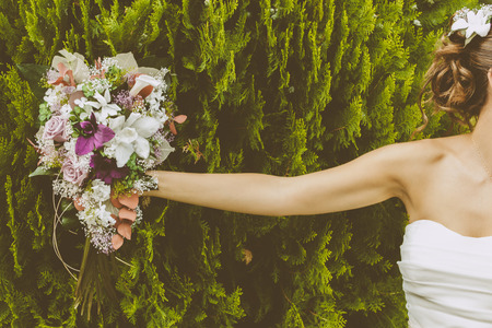 Bride with a Beautiful Bouquet of Flowersの写真素材