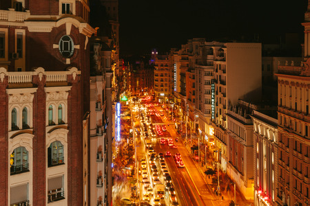 MADRID, SPAIN - SEPTEMBER 20: View Gran Via at night, one of the main streets and most famous landmarks of the city, on September 20, 2014 in Madrid, Spainのeditorial素材