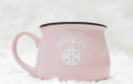 Pink coffee cup, white backgroundの写真素材