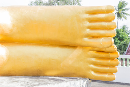 Feet of reclining Buddha gold statue at Phuket, Thailandの写真素材